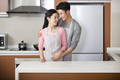 Happy young couple in kitchen - PhotoDune Item for Sale