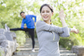 Happy mature woman exercising in park - PhotoDune Item for Sale
