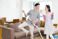 Young couple doing chores at home - PhotoDune Item for Sale