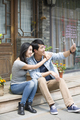 Young couple taking self portrait with smart phone - PhotoDune Item for Sale