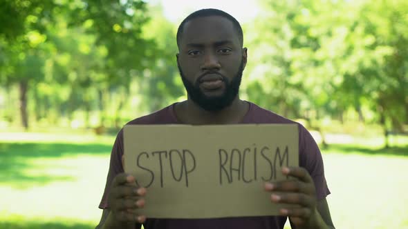 Afro-American Man Showing Stop Racism Sign, Social Judgment, Equal Rights