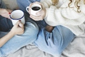 Women holding cup of hot drinks together - PhotoDune Item for Sale