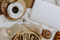 Walnuts in a wooden box served with a cup of coffee next to a laptop - PhotoDune Item for Sale
