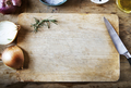 Cutting board and vegetables on a wooden table - PhotoDune Item for Sale
