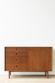 Mid century modern wood cabinet by a white wall - PhotoDune Item for Sale