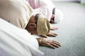 Muslim people praying in Sujud posture - PhotoDune Item for Sale