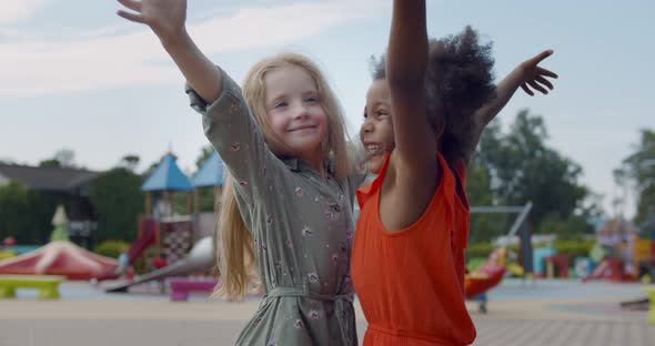 Diverse Happy Kids Hugging on Children Playground