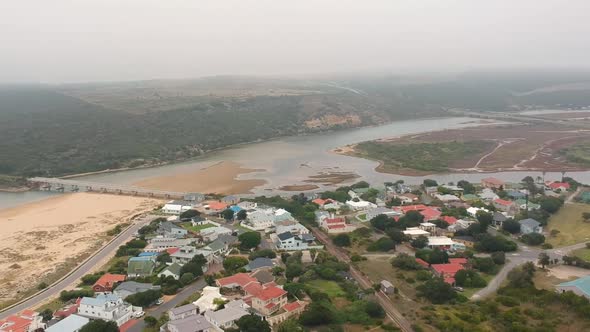 Aerial Pan shot of tropical lagoon draining into ocean