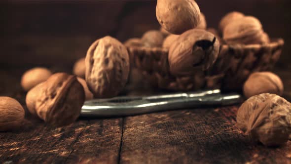 Super Slow Motion a Lot of Walnuts Falls on the Table