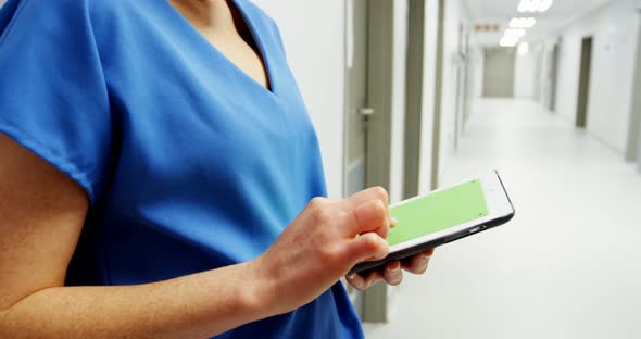 Nurse using digital tablet