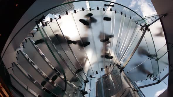 Slow Motion of People Moving and Walking Along a Modern Staircase