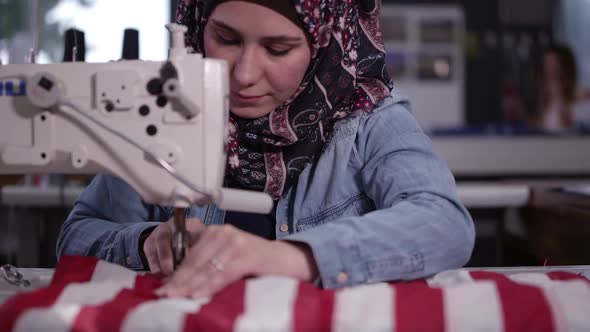 Woman sewing American flag
