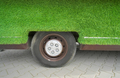 Grass covered car and wheel. - PhotoDune Item for Sale