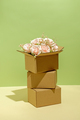 Cardboard boxes packing on and blooming bouquet of pink roses - PhotoDune Item for Sale