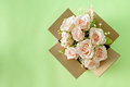 beautiful blooming bouquet of pink roses in a parcel delivery cardboard box - PhotoDune Item for Sale