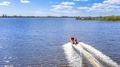 Rigid inflatable boat speeding on water of dutch lake - PhotoDune Item for Sale