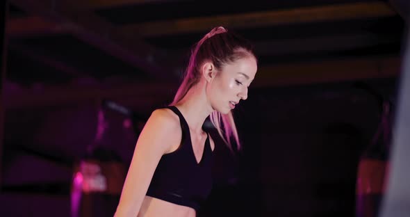 Young Female Athlete Doing Workout At Gym