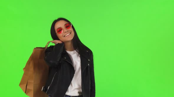 Happy Young Woman Posing with Her Shopping Bags on Chromakey