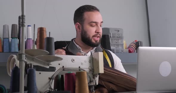 Man doing sewing courses online