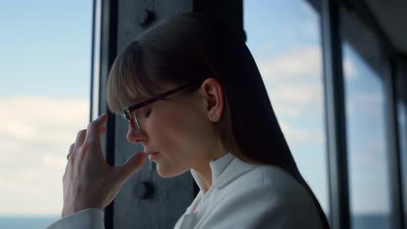 Stressed Businesswoman Looking Solution in Suit Closeup