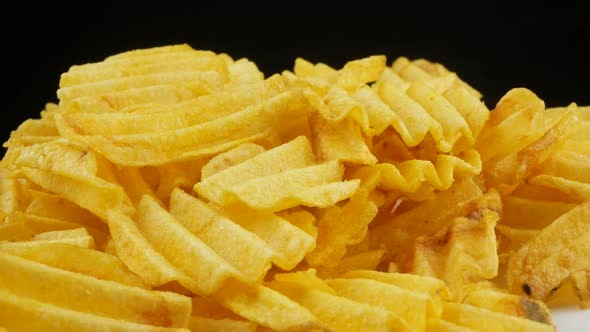 Ribbed potatoes snack chips close up