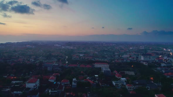 Aerial View Flight At Sunset Over The City By The Ocean