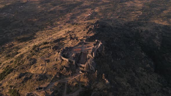 Epic aerial view over Monsanto fortress ruins at sunrise, Portugal