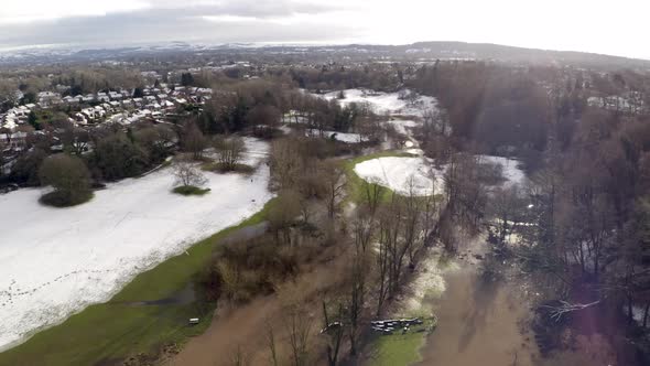 Aerial footage from Drone showing the river Bollin in Wilmslow, Cheshire after heavy rain, showing b