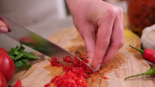 Woman Hands Slicing Chopping Chili Pepper at Domestic Kitchen