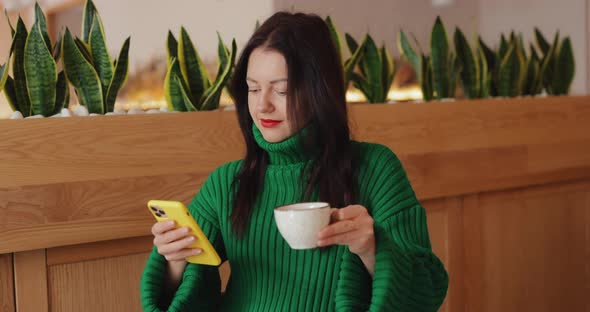 Internet Addiction Woman Uses Phone While Drinking Coffee