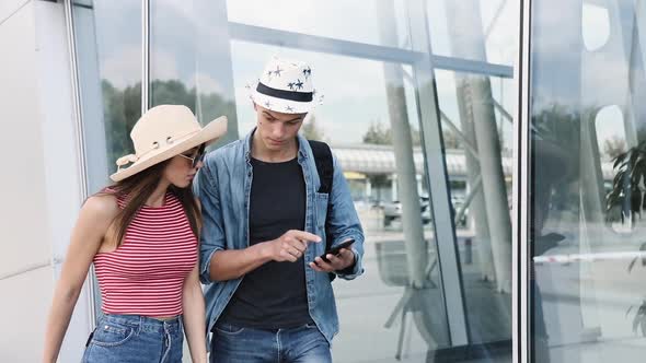 Couple Late For Flight. People Traveling, Running At Airport