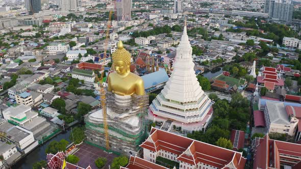 Aerial view of the Giant Golden Buddha in Wat Paknam Phasi Charoen