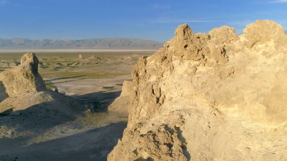 Flying Over the Desert Terrain of Trona Pinnacles on a Sunny Day