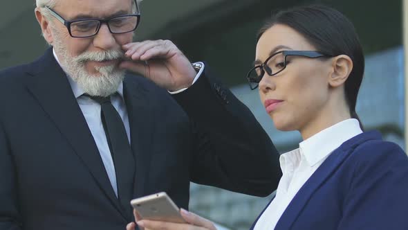 Old Boss Looking With Desire at Secretary, Concept of Sexual Harassment at Work