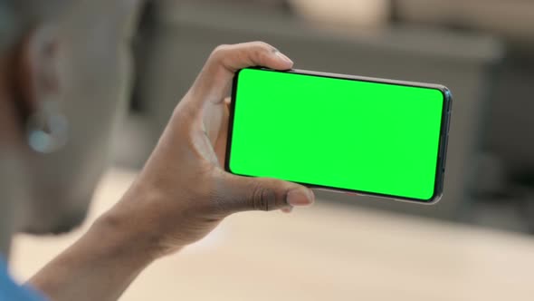 African Man Watching Smartphone with Chroma Screen