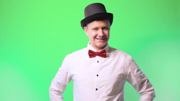 Young Man in a Hat and Bowtie Glasses Happy Performer Chromakey