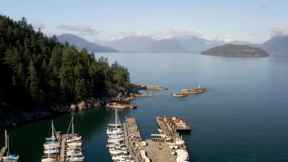 Docked Boats In Sewell's Marina Adventure Centre With Scenic View Of Nature In Horseshoe Bay, BC, We