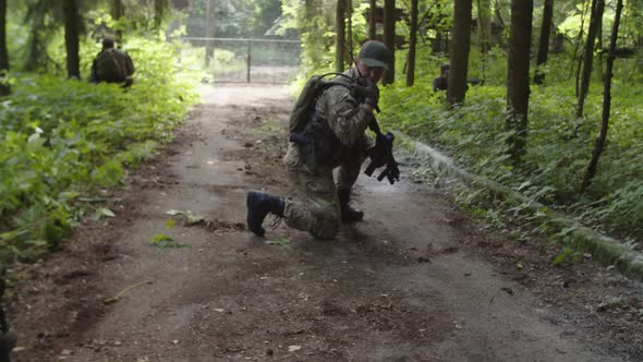 Armed Soldier Using Radio Communication Calling Evacuation Transport alt