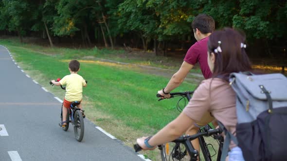 Active family of bikers on cycle ride in summer