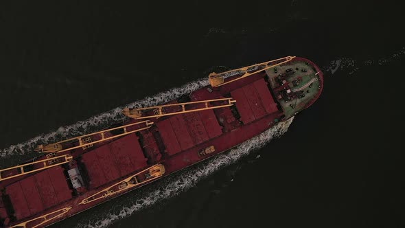 Top View Merchant Cargo Bulker with Closed Holds Filled Coarse Grain Sailing Open Sea