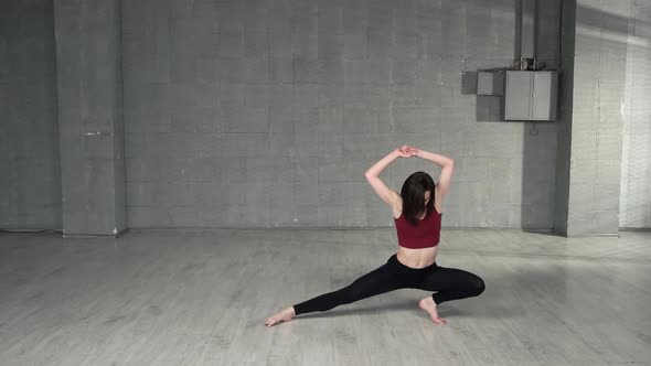 Athletic Girl Warming Up Before Dancing Class