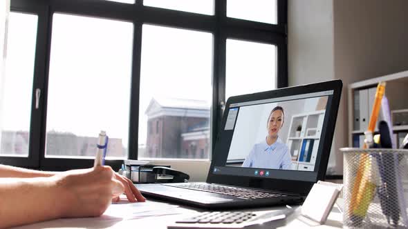 Woman with Laptop Having Video Call at Office