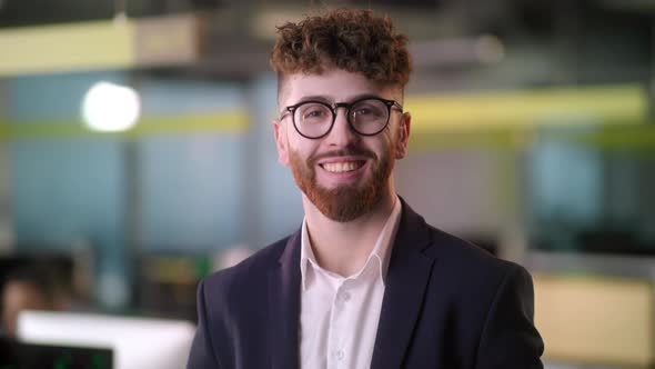 Portrait of Cheerful Male Boss in Suit with Beard Looking to Camera and Smiling