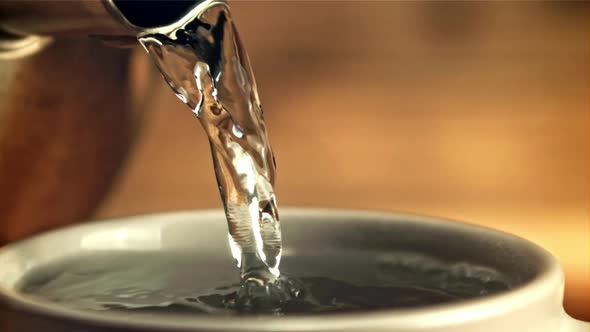 Hot Water is Poured Into a Coffee Mug