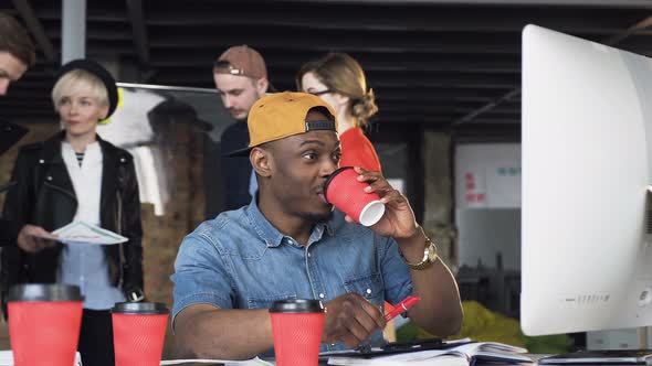 Portrait of Busy Young Afro American Businessman Working in Modern Office