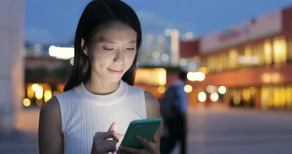 Woman use of cellphone at night 