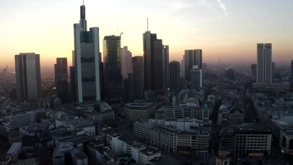 AERIAL: View of Frankfurt Am Main, Germany Skyline with Sunflair Between Skyscrapers in Beautiful