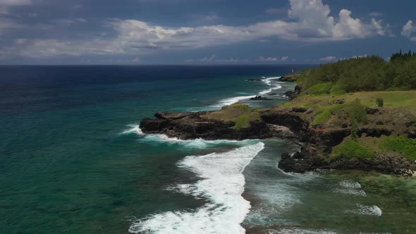 View of the Famous Golden Beach Between Black Volcanic Rocks on the Banks of the Gris-Gris River