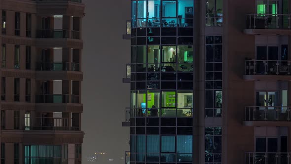 Flat Night Panorama of Multicolor Light in Windows of Multistory Buildings Aerial Timelapse