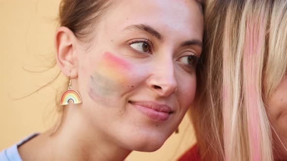 A close-up view of woman standing with her friends enjoying pride gay parade